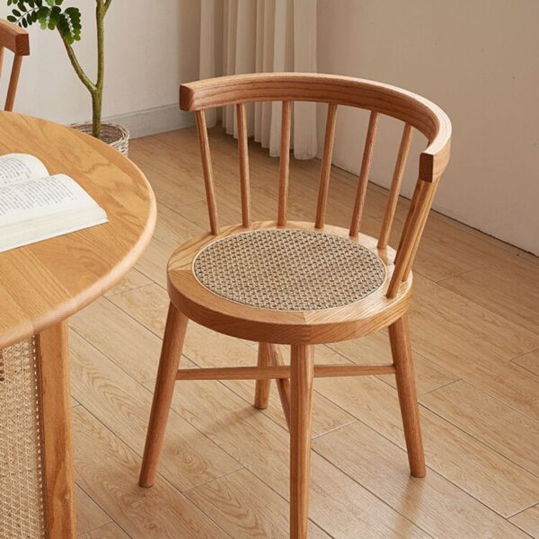 Eberly Wood Dining Chair beside a modern table, illustrating a practical and stylish dining setup