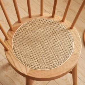 Top view of Eberly Wood Dining Chair showing intricately woven rattan seat and smooth beech wood finish