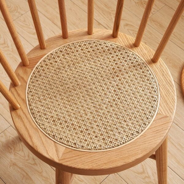 Top view of Eberly Wood Dining Chair showing intricately woven rattan seat and smooth beech wood finish