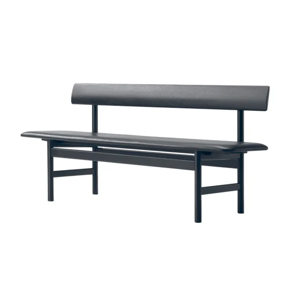 Side angle view of the Visiteur bench in black, featuring an all-black beech wood frame and black faux leather seat, emphasizing its sleek, minimalist design and contemporary aesthetic