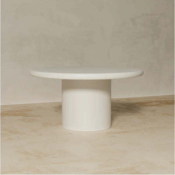 Shiro white round dining table made of painted mdf by kersetna lebanon in a neutral setting