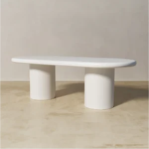 Side view of Shiro white oval dining table made of painted mdf by kersetna lebanon in a neutral setting