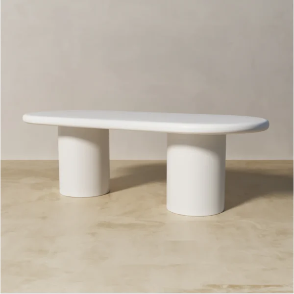 Side view of Shiro white oval dining table made of painted mdf by kersetna lebanon in a neutral setting