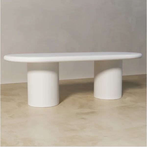 Side view of Shiro white oval dining table made of painted mdf by kersetna lebanon in a neutral setting