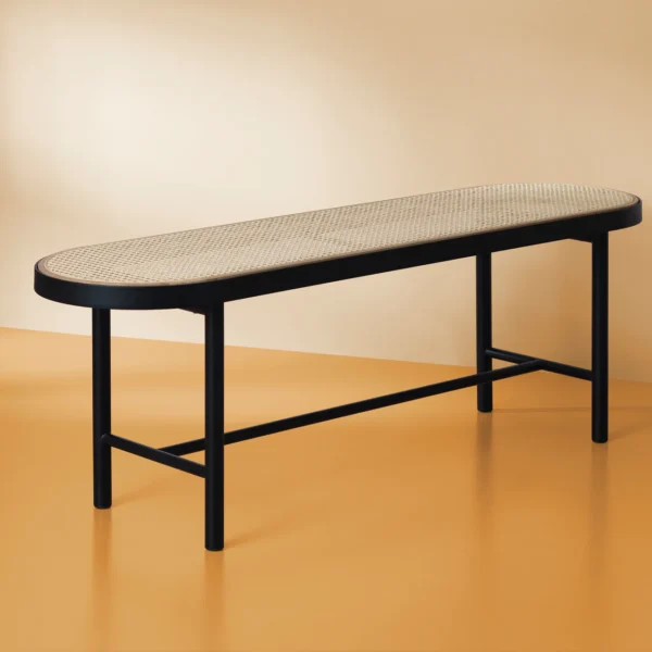 Tray rattan bench, black wooden frame,rattan seat in a minimalist background