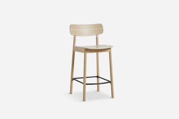 Angled view of the yuri counter stool in oak