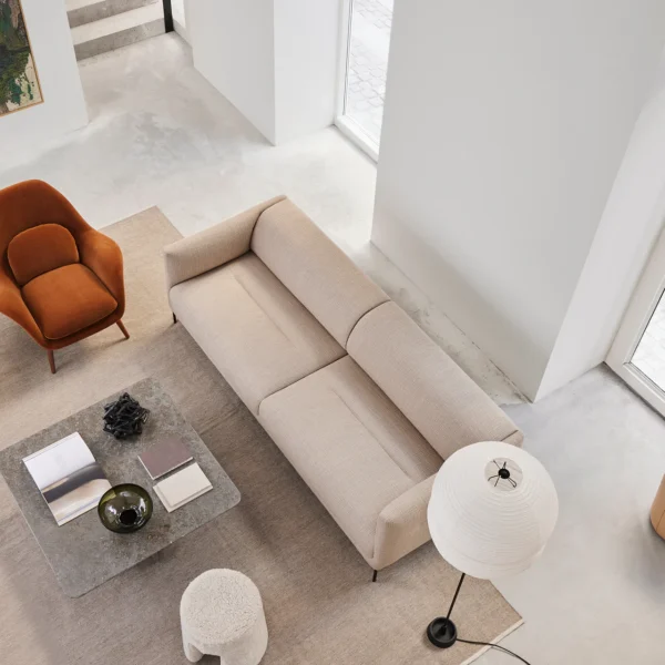 Top view of Nu two seater sofa in a modern living room, showcasing meticulous design and serenity