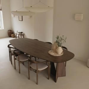 Oval dining table crafted in Lebanon from solid French oak and French oak veneer, designed for timeless gatherings