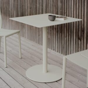 Outdoor square bistro table, with a single pipe column that sits on a round steel base on the floor , powdercoated in greyish green