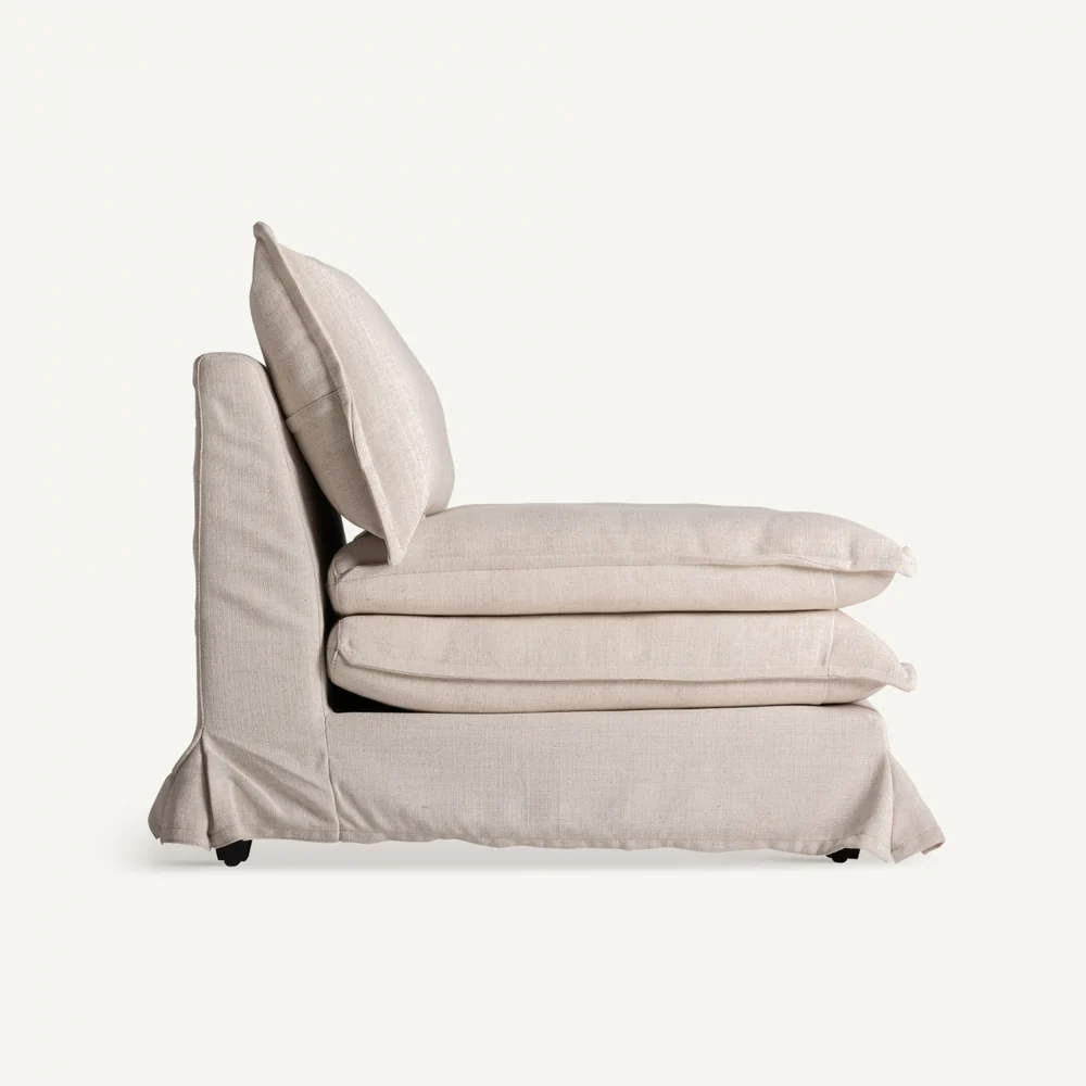 Side profile of the Lynn Lounge Chair with double seat cushions and slipcover