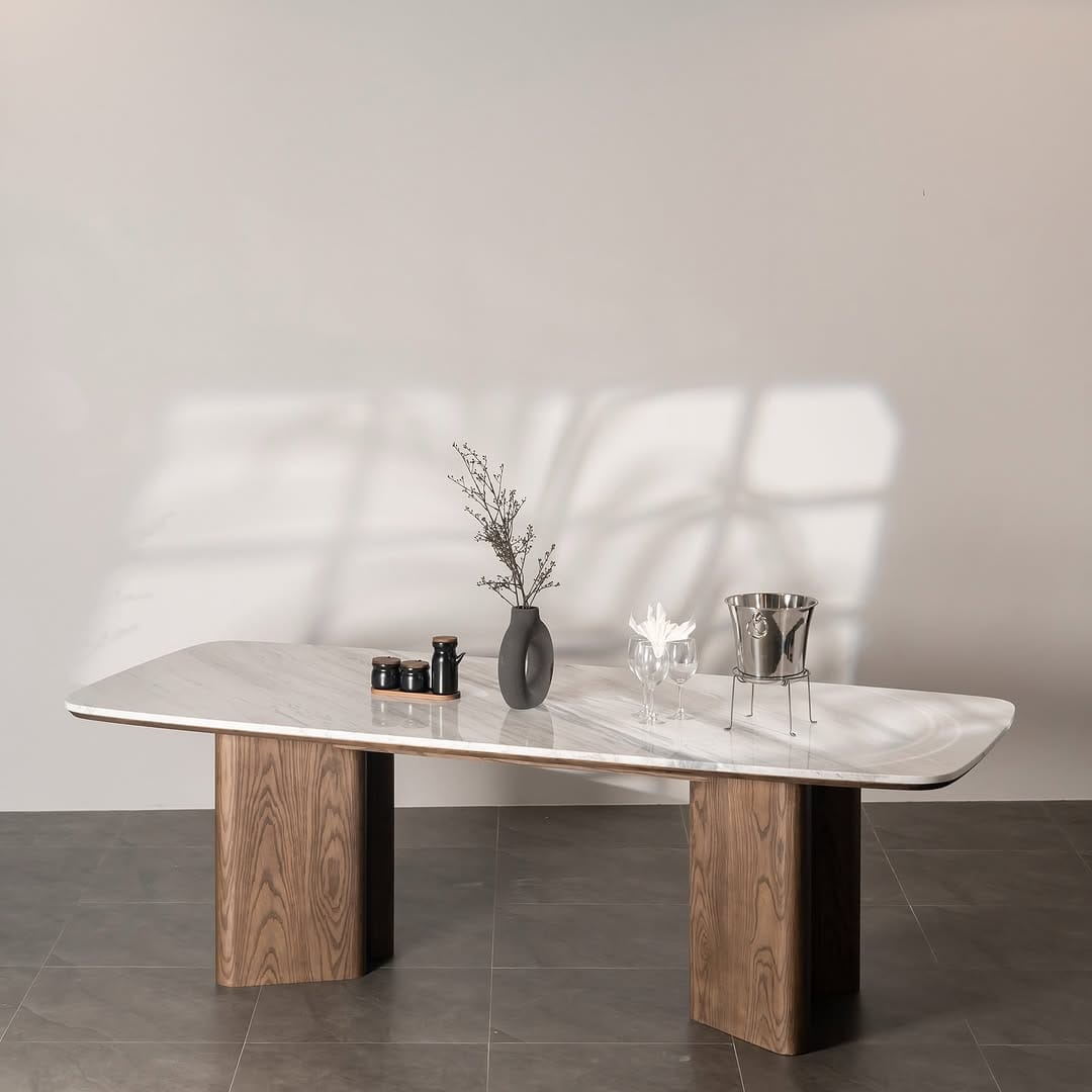 Handcrafted dining table in Lebanon with a solid ash wood base and Volakas marble top — modern and timeless design