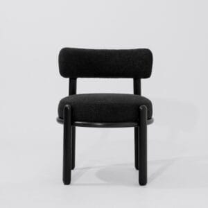 Front view of Minuit dining chair, frame made of solid wood painted in black , Backrest and seat-pad are both cushioned and upholstered in black boucle fabric, handcrafted by kersetna in lebanon