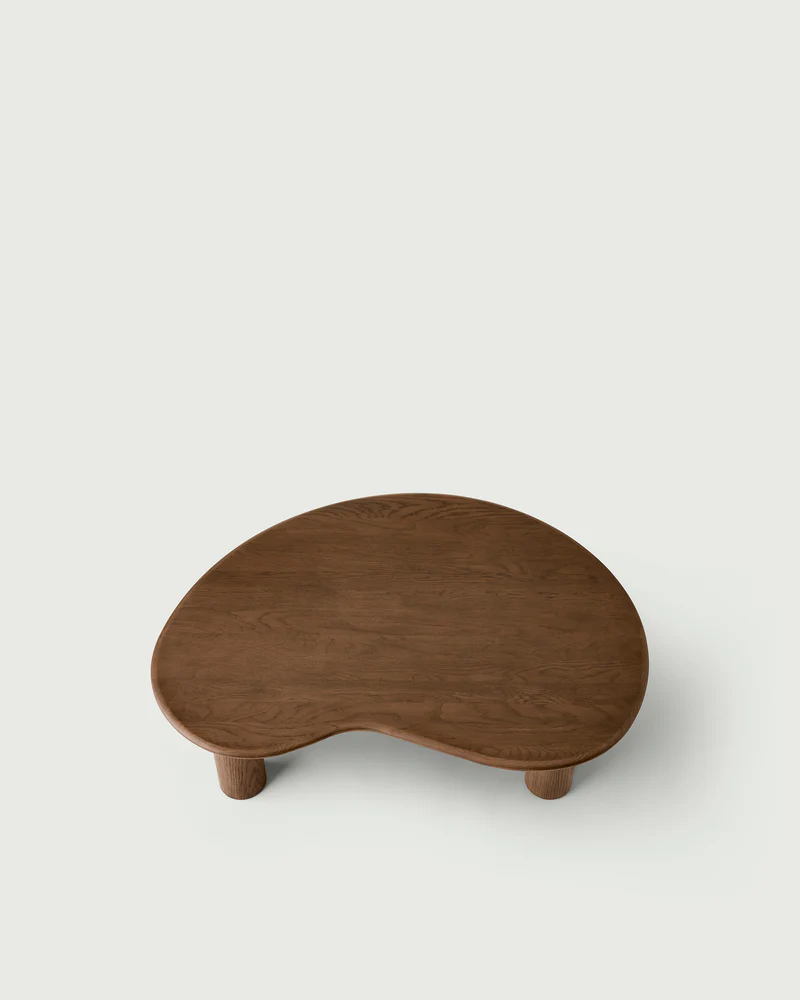 top view of olly coffee table highlighting the elegant grain of oak and the cloud shaped organic table top