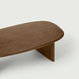 Close up showing the table top and one leg , highlighting the oak grain