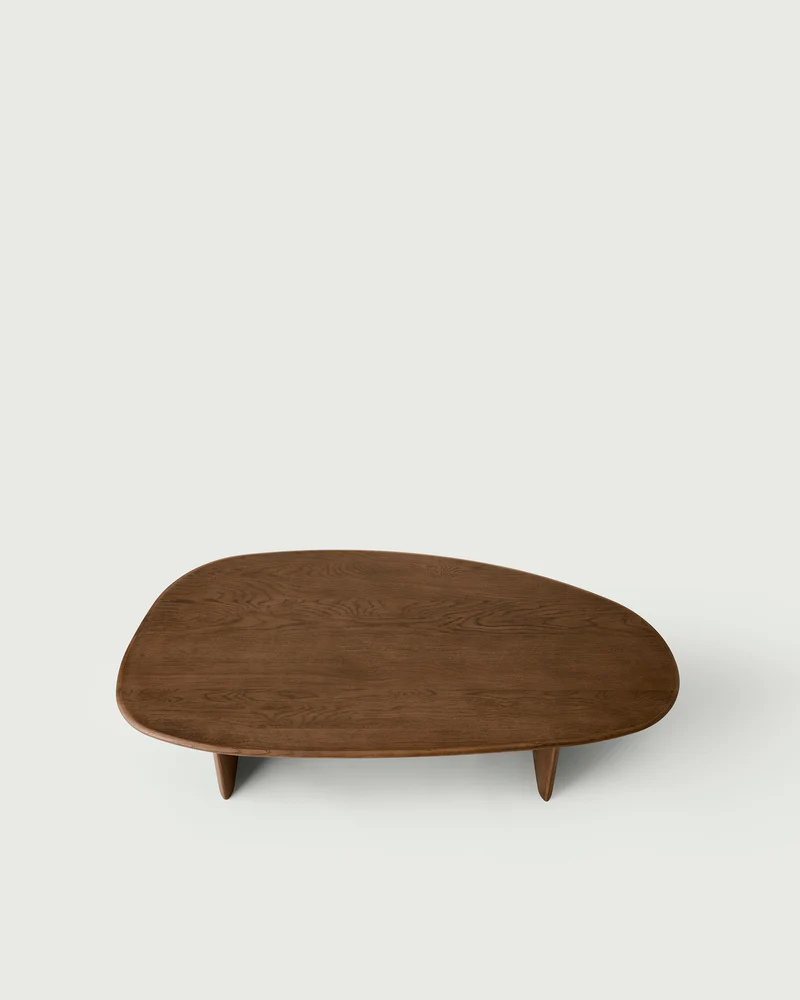 top view of santos coffee table in oak and oak veneer positioned in a white interior space